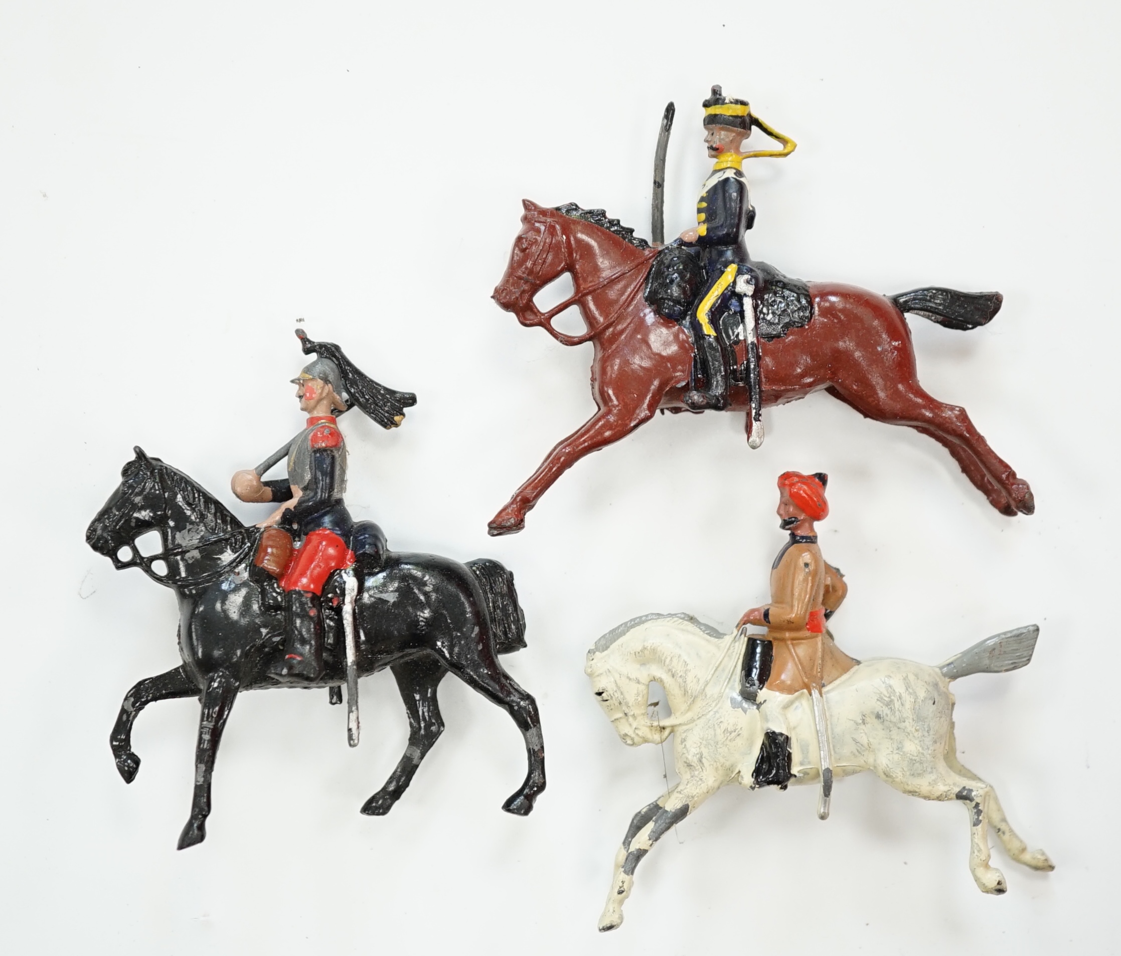 Twenty-six early twentieth century Britains, etc. cavalry soldiers including; fifteen Hussars, Indian cavalry, Royal Lancers, etc.